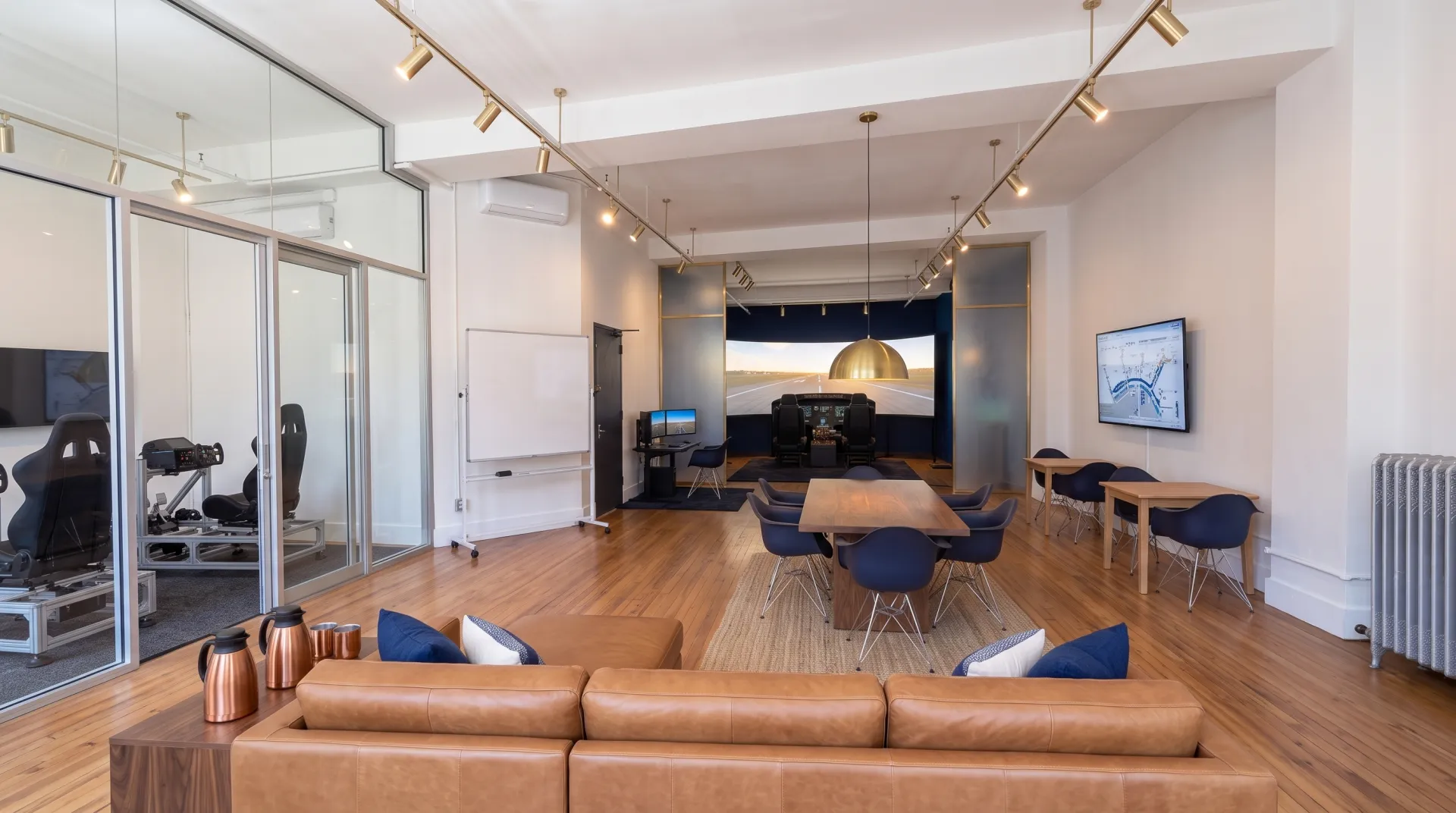 Concept render of Aviator.NYC’s planned Midtown Manhattan location showing the Cirrus G3000 simulator bay, briefing area, and training floor