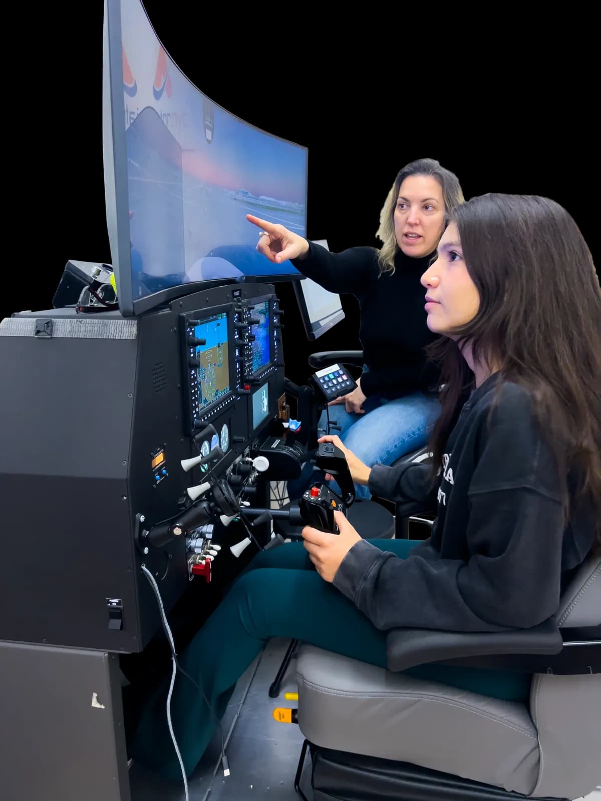 Aviator.NYC instructor guiding a student through a lesson on a Garmin G1000 flight simulator