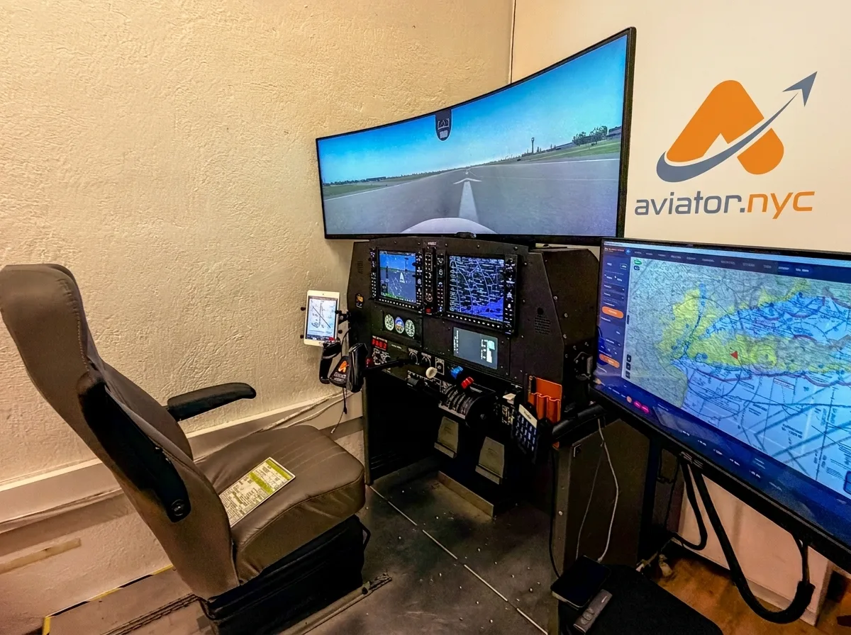 PFC GTX flight simulator pilot seat and training station with 49-inch curved display at Aviator.NYC Manhattan