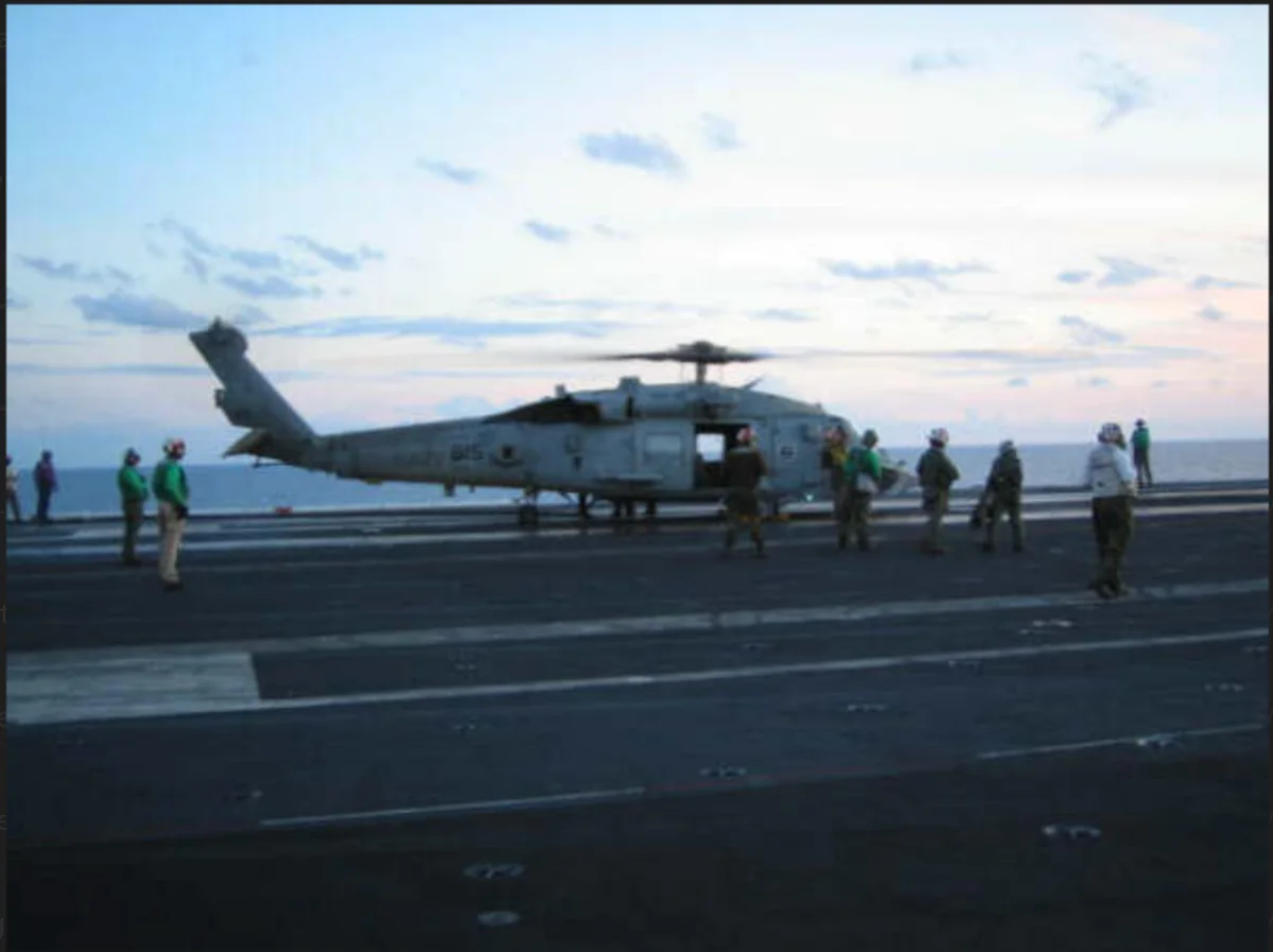 Helicopter on the flight deck of a Navy aircraft carrier during Julian's deployment